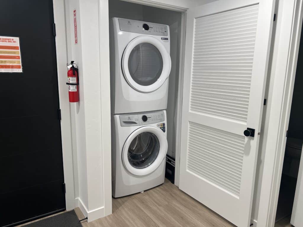 Stacked washer and dryer in closet