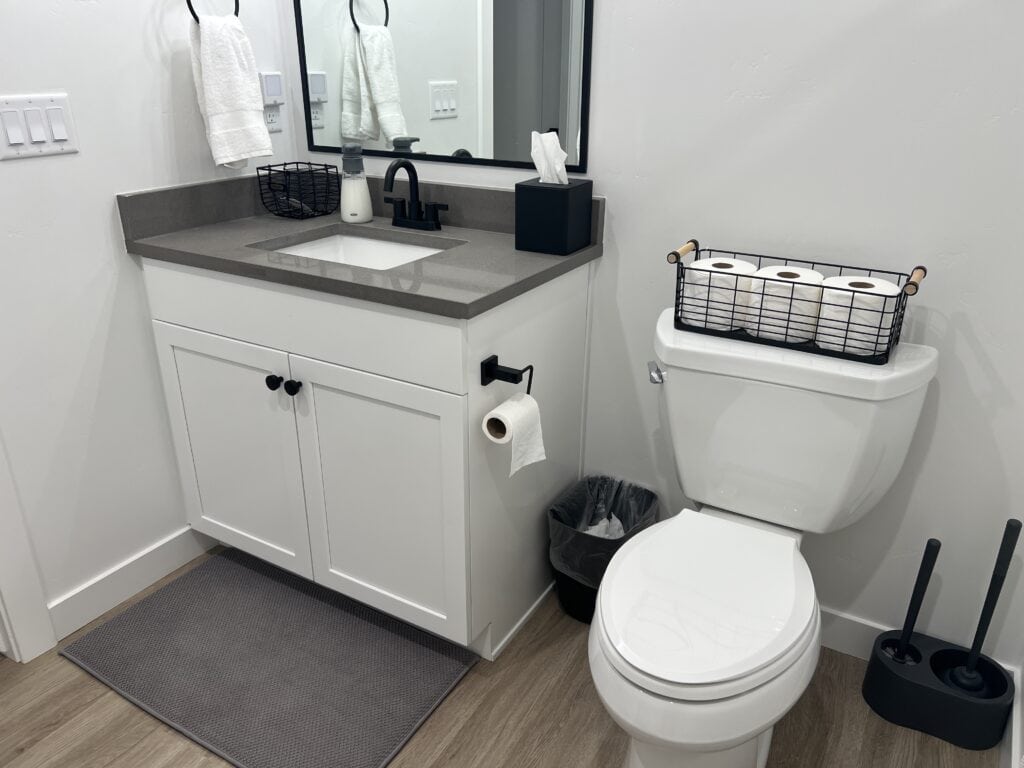 Modern bathroom with sink and toilet.