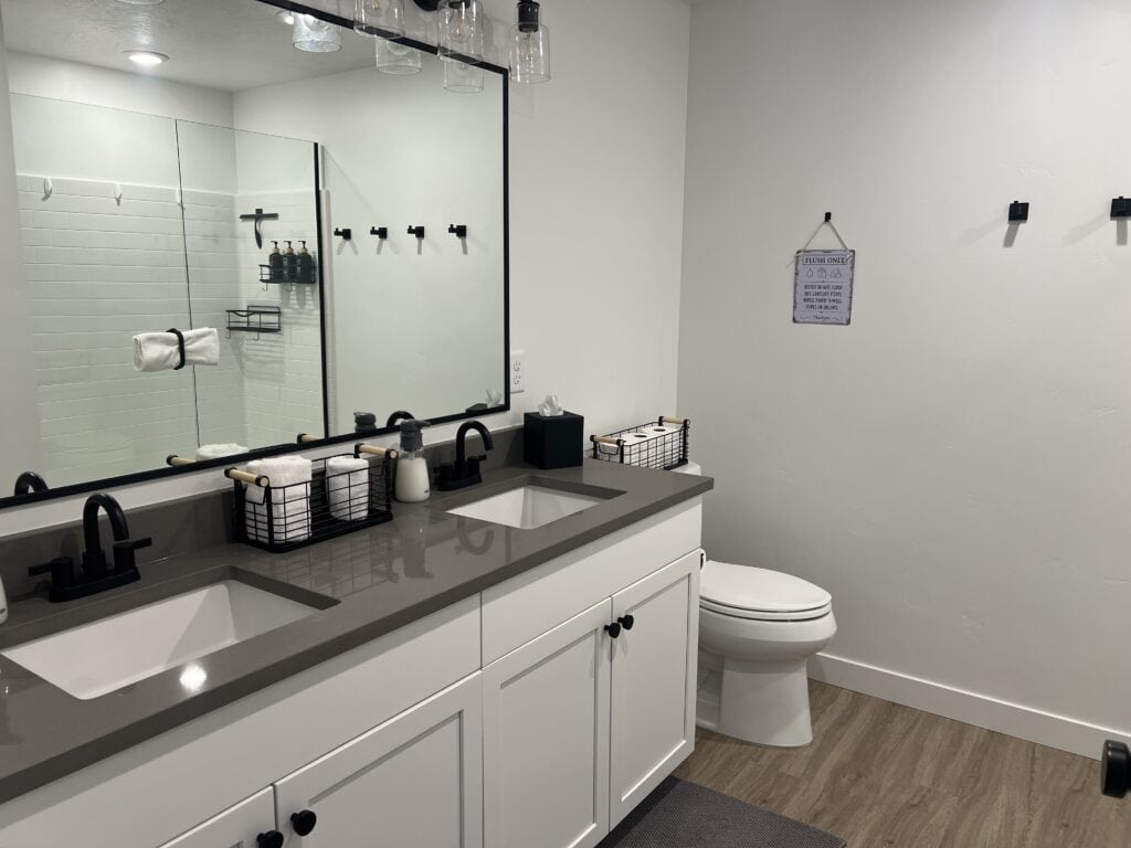 Modern bathroom with dual sink and shower