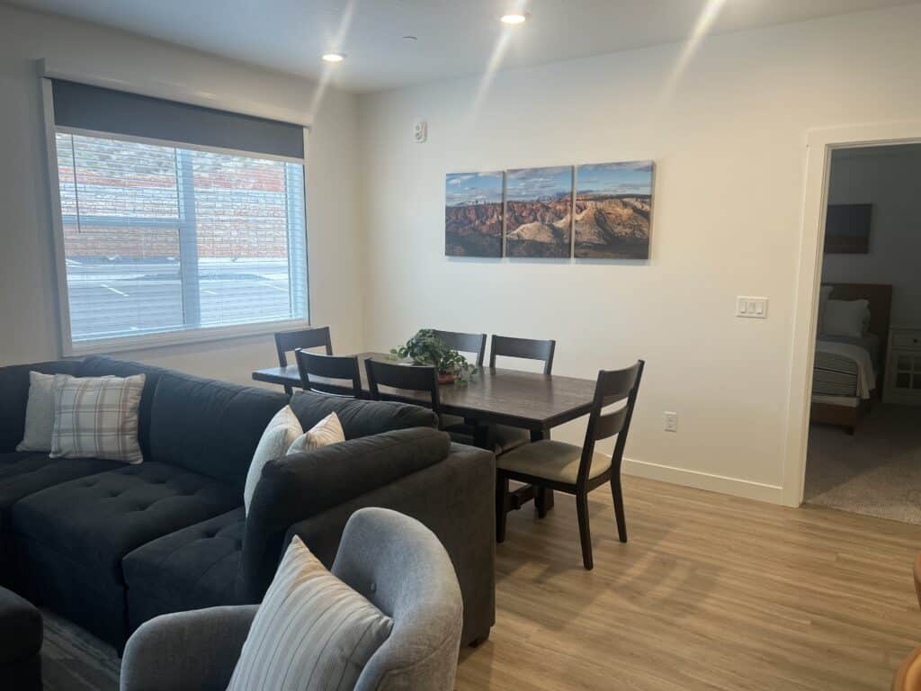 Cozy living room with dining area and artwork.